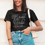 Bride Tribe White Modern Script Custom Wedding T-Shirt<br><div class="desc">Modern and casual chic white calligraphy script "Bride Tribe" women's wedding tee shirt features custom text that can be personalized for your bridal party crew. Perfect for your bridesmaids to wear at the bachelorette party and the wedding weekend!</div>