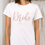 Bride Wedding Personalized Name Dusty Pink White T-Shirt<br><div class="desc">Celebrate the bride-to-be with a unique custom t-shirt! A simple and stylish design featuring trendy script lettering,  and personalized with the bride's name,  wedding date,  location or other text. This stylish dusty pink and white t-shirt,  makes a lovely gift for a bachelorette party,  wedding shower or celebration weekend!</div>