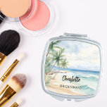 Bridesmaid beach wedding compact mirror<br><div class="desc">A tropical beach,  waves and palm trees,  watercolored.  Personalize and add your bridesmaid's name.   Black handwritten style script.</div>
