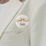 Bridesmaid bow beige cream name tag 1 inch round button<br><div class="desc">A beige,  cream coloured background. Decorated with a large bow.  Personalize and add your bridesmaid's name.   Black handwritten style script.</div>