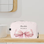 Bridesmaid bow pink elegant name dopp kit<br><div class="desc">A soft blush pink background. Decorated with a large pink bow.
Personalize and add your bridesmaid's name.</div>