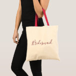 Bridesmaid Burgundy font Tote Bag<br><div class="desc">A beautiful tote bag for a beautiful bridesmaid, this design features "Bridesmaid" written in lovely cursive burgundy font. Place your order today!</div>