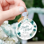 Bridesmaid Elegant Teal Floral Wreath Wedding Keychain<br><div class="desc">These keychains are designed to give as favours to bridesmaids in your wedding party. They feature a rustic hand painted watercolor design with a wreath of roses and flowers in shades of teal, turquoise, aqua, and cyan. The text is written in elegant script letters, and there is room for her...</div>