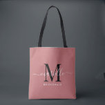 Bridesmaid Gift Black White Monogram Dusty Rose Tote Bag<br><div class="desc">This Bridesmaid tote bag features a handwritten white and black script typography monogram with swashes on a dusty rose background. Present your bridesmaids with a tote for carrying items the day of the wedding,  and traditionally presented at the rehearsal dinner or before.</div>