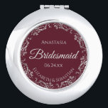 Bridesmaid Gift Elegant Burgundy & Silver Lace Compact Mirror<br><div class="desc">These compact mirrors are designed to give as favours to the bridesmaids in your wedding party. They feature a simple yet elegant design with a burgundy, maroon, or wine-red coloured background, script lettering, and a silver grey faux foil floral lace border. Perfect way to thank your bridesmaids for being a...</div>