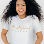 Bridesmaid Gold Custom Name Bachelorette T-Shirt<br><div class="desc">The Bridesmaid Gold Custom Name Bachelorette T-Shirt is a modern and minimalist statement piece for your bridal party. Featuring a sleek faux gold script, this simple yet stylish shirt is perfect for bachelorette festivities and can be customized with each bridesmaid's name. It’s a chic and practical wedding party gift that...</div>