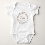 Bridesmaid in Training Pink Floral Wreath Cute Baby Bodysuit<br><div class="desc">This cute baby body suit is designed as a wedding gift for all of your wedding party babies. It features a beautiful design with a wreath of pink watercolor roses and blossoms and elegant script lettering reading "Bridesmaid in training." There is space for her name at the bottom. Wonderful gift...</div>