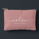 Bridesmaid Modern Minimal Script Dusty Pink Accessory Pouch<br><div class="desc">This Bridesmaid accessory bag features a handwritten white script typography with swashes on a dusty pink background. Present your bridesmaids with a toiletry bag for their makeup and small items traditionally presented at the rehearsal dinner,  for use in the early morning before the wedding.</div>
