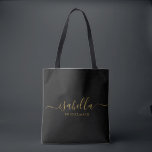 Bridesmaid | Modern Minimalist Script Bachelorette Tote Bag<br><div class="desc">This Bridesmaid accessory bag features a handwritten gold script typography with swashes on a black background. Present your bridesmaids with a tote bag for small items traditionally presented at the rehearsal dinner,  for use in the early morning before the wedding.</div>