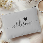 Bridesmaid Modern Script Warm Grey Heart Accessory Pouch<br><div class="desc">This elegant accessory pouch features a stylish warm grey background adorned with a modern script font displaying a personalized name and a charming heart design. The soft, feminine colour and sophisticated typography make it a perfect accessory for bridesmaids or anyone who appreciates chic and trendy designs. Its versatile use and...</div>