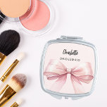 Bridesmaid pink bow elegant compact mirror<br><div class="desc">A pink bow and background.  Personalize and add your bridesmaid's name.   Black handwritten style script.</div>