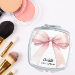 Bridesmaid pink bow elegant compact mirror<br><div class="desc">A pink bow,  white background.  Personalize and add your bridesmaid's name.   Black handwritten style script.</div>