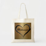 Bridesmaid Tote Bag with Gold Glitter and Heart<br><div class="desc">Gorgeous,  luxe bridesmaid tote bag begins with a deep glitterly gold background. A bold open black heart creates a romantic flair. The word Bridesmaid is written in an ornate fancy script. Keep it bridesmaid or change it to the name of the bridesmaid. Unique wedding welcome gift for a bridesmaid.</div>