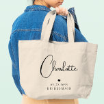 Bridesmaid Wedding Simple Modern Script Name<br><div class="desc">Bridesmaid Wedding Simple Modern Calligraphy Script Personalized Name Tote Bags features your bridesmaid's name in elegant black calligraphy script accented with a simple love heart with the addition of your custom text such as the date and bridemaid. Text and heart colours can be adjusted in the editor to suit your...</div>