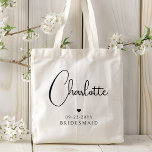 Bridesmaid Wedding Simple Modern Script Name Tote Bag<br><div class="desc">Bridesmaid Wedding Simple Modern Calligraphy Script Personalized Name Tote Bags features your bridesmaid's name in elegant black calligraphy script accented with a simple love heart with the addition of your custom text such as the date and bridemaid. Text and heart colours can be adjusted in the editor to suit your...</div>