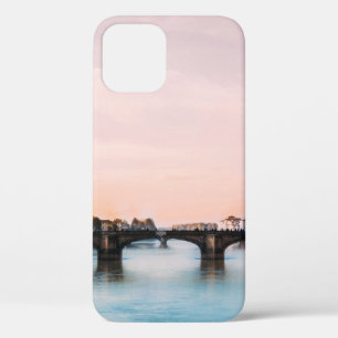 BRIDGE CROSSING RIVER IN TOWN UNDER CLOUDY SKY iPhone 12 CASE
