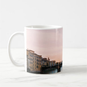 BRIDGE CROSSING RIVER IN TOWN UNDER CLOUDY SKY COFFEE MUG