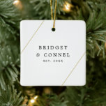 Bridget Geometric Newlywed Modern Ceramic Ornament<br><div class="desc">Did you get married this year? Add a memory to your Christmas tree with this modern wedding keepsake ornament with geometric gold lines, one on the top left and one on the bottom right, over a white background. Use the template to add your names and year of your wedding to...</div>