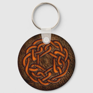 Bright orange celtic knot on leather keychain