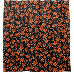 Bright orange flowers on a black background with w
