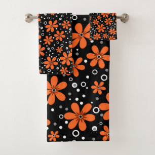 Bright orange flowers on a black background with w bath towel set