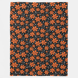 Bright orange flowers on a black background with w fleece blanket