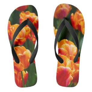 Bright orange tulips in the park   flip flops