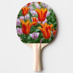 Bright orange tulips in the park ping pong paddle