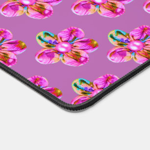 Bright pink, purple hand sewn flowers on magenta desk mat
