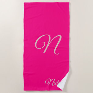 Bright pink solid colour monogrammed beach towel