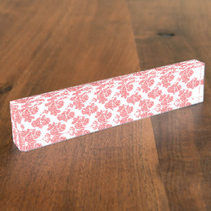 Bright red and pink floral wrapping paper featurin nameplate