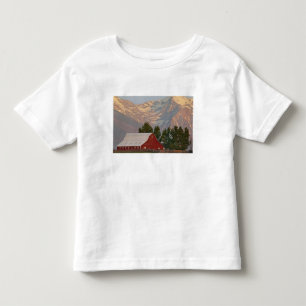 Bright red barn against Mission Mountains in Toddler T-shirt