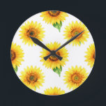 Bright Sunflower Watercolor Seamless Pattern Round Clock<br><div class="desc">Radiant joy in full bloom! This cheerful, hand-painted watercolor pattern bursts with large, golden sunflowers against crisp white, each bloom detailed with warm amber centers, soft petals, and fresh green leaves. A timeless, uplifting floral design that brings instant summer happiness and sunshine vibes.</div>