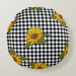 Bright sunflowers on a black and white buffalo che round pillow