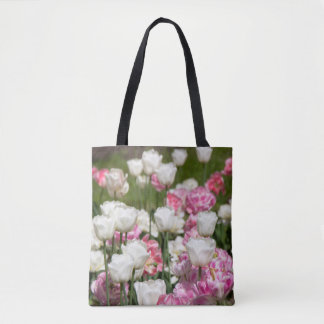 Bright white and pink tulips on a sunny day tote bag