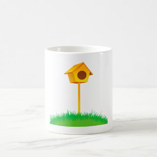 Bright Yellow Birdhouse on Grass Coffee Mug