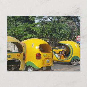 Bright yellow fun coco taxis from Cuba Postcard