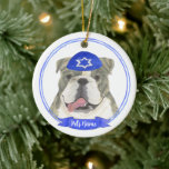 Brindle & White English Bulldog Hanukkah Ceramic Ornament<br><div class="desc">Celebrate your favourite mensch on a bench with a personalized ornament! This design features a sweet illustration of a brindle and white english bulldog dog with a blue and white yarmulke. For the most thoughtful gifts, pair it with another item from my collection! To see more work and learn about...</div>