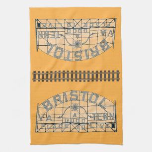 Bristol Slogan Sign with Tracks on Orange Kitchen Towel