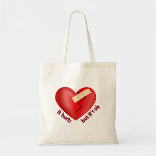 Broken heart healed with patch and life quote tote bag