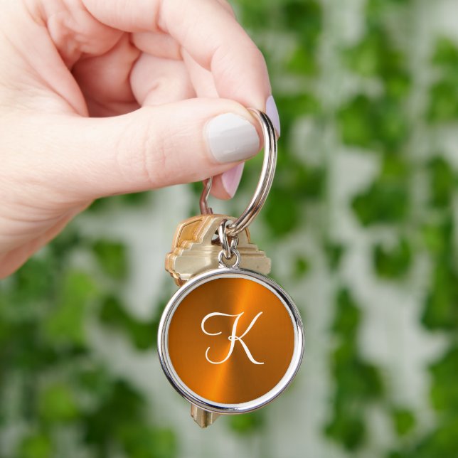 Bronze shiny faux metal monogram keychain (Hand)