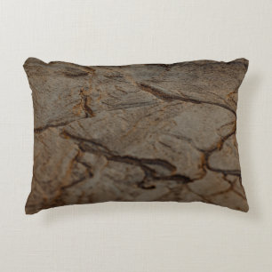 Brown and black wooden surface accent pillow