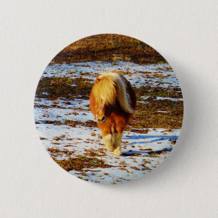 Brown and cream miniature horse in the snow. 2 inch round button