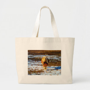 Brown and cream miniature horse in the snow. large tote bag