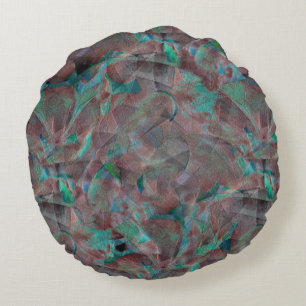 Brown and cyanish spots on unfinished wall plaster round pillow