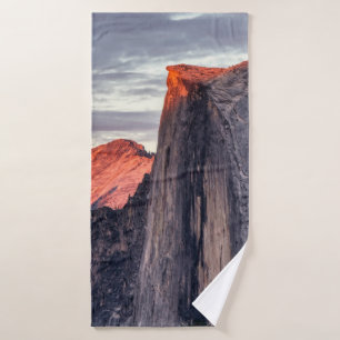 BROWN AND GRAY ROCK FORMATION UNDER GRAY CLOUDS BATH TOWEL