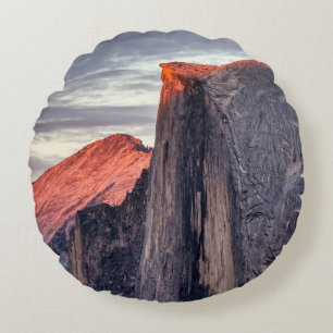 BROWN AND GRAY ROCK FORMATION UNDER GRAY CLOUDS ROUND PILLOW