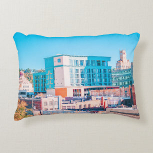 BROWN AND WHITE CONCRETE BUILDING UNDER BLUE SKY ACCENT PILLOW
