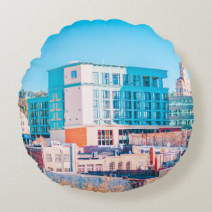 BROWN AND WHITE CONCRETE BUILDING UNDER BLUE SKY ROUND PILLOW