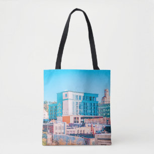 BROWN AND WHITE CONCRETE BUILDING UNDER BLUE SKY TOTE BAG